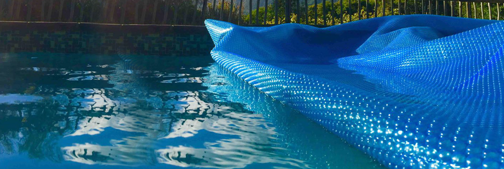 How Solar Covers Save You Money While Maximizing Use of Your Swimming Pool